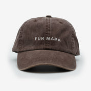 A brown denim cap with the text 'FUR MAMA' embroidered on the front.