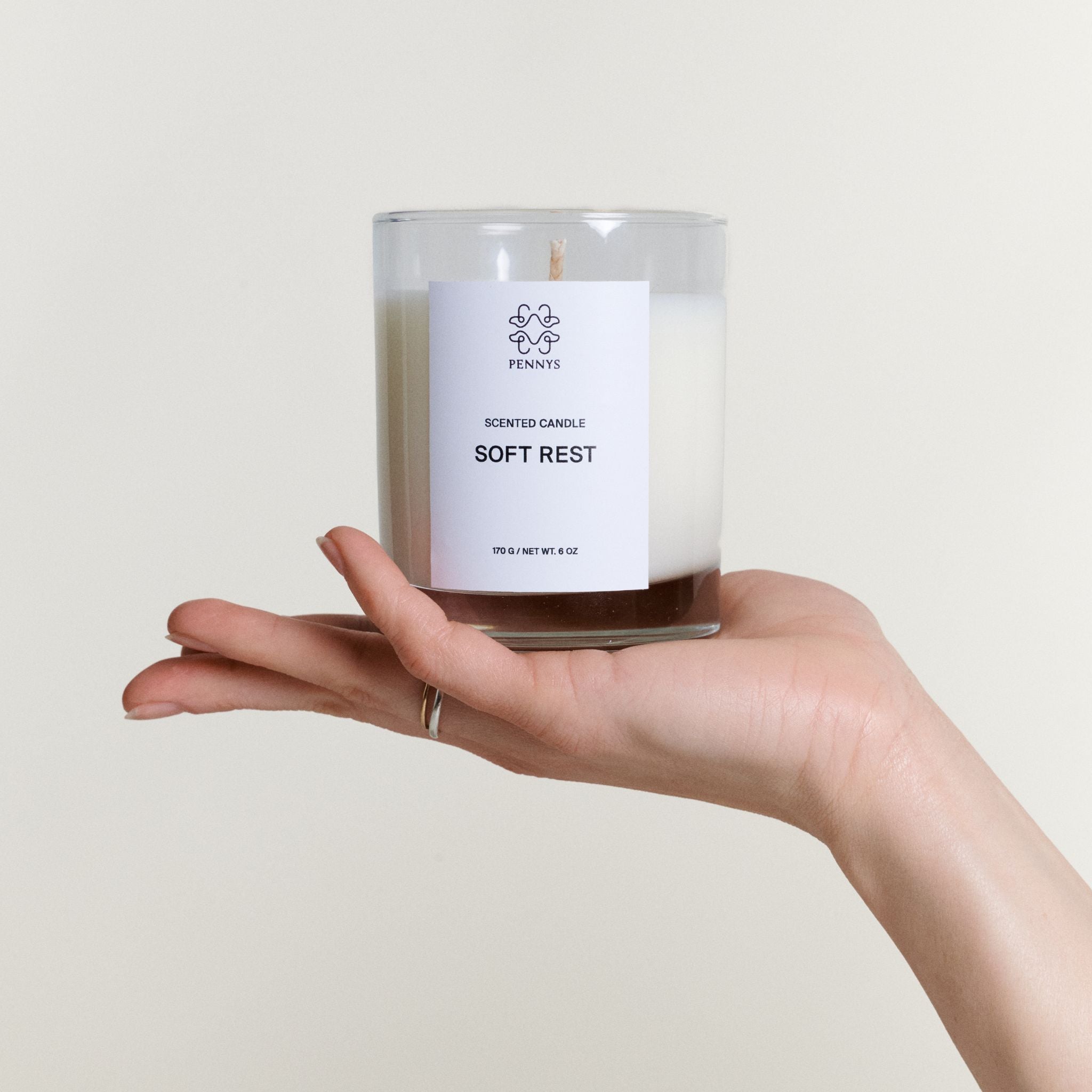 pennys-dog-spa-candle-holding-in-hand.jpg
